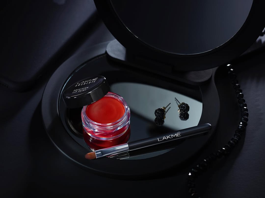 Cosmetics product photography shoot of lakme on black bg